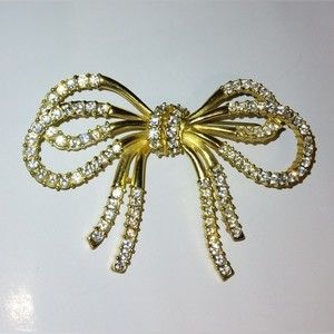 Goldtone Bow brooch pin with clear stones ribbon see video